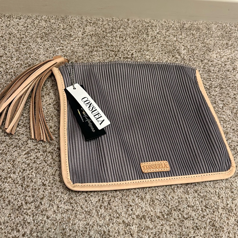 Silver/gray with tan leather binding consuela wristlet